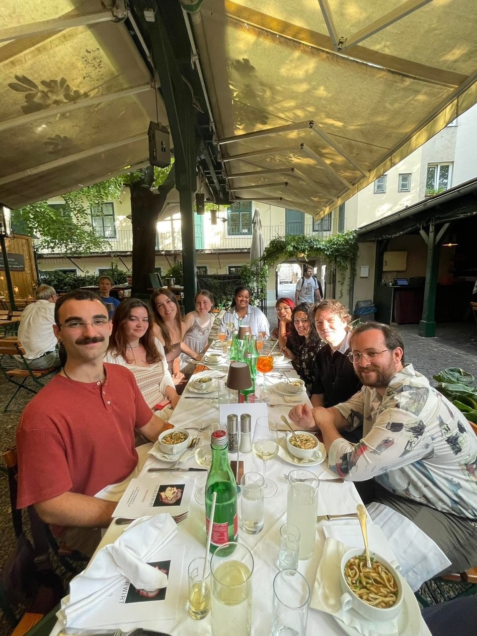 A group of students and their professor sitting in a restaurant somewhere in Austria.